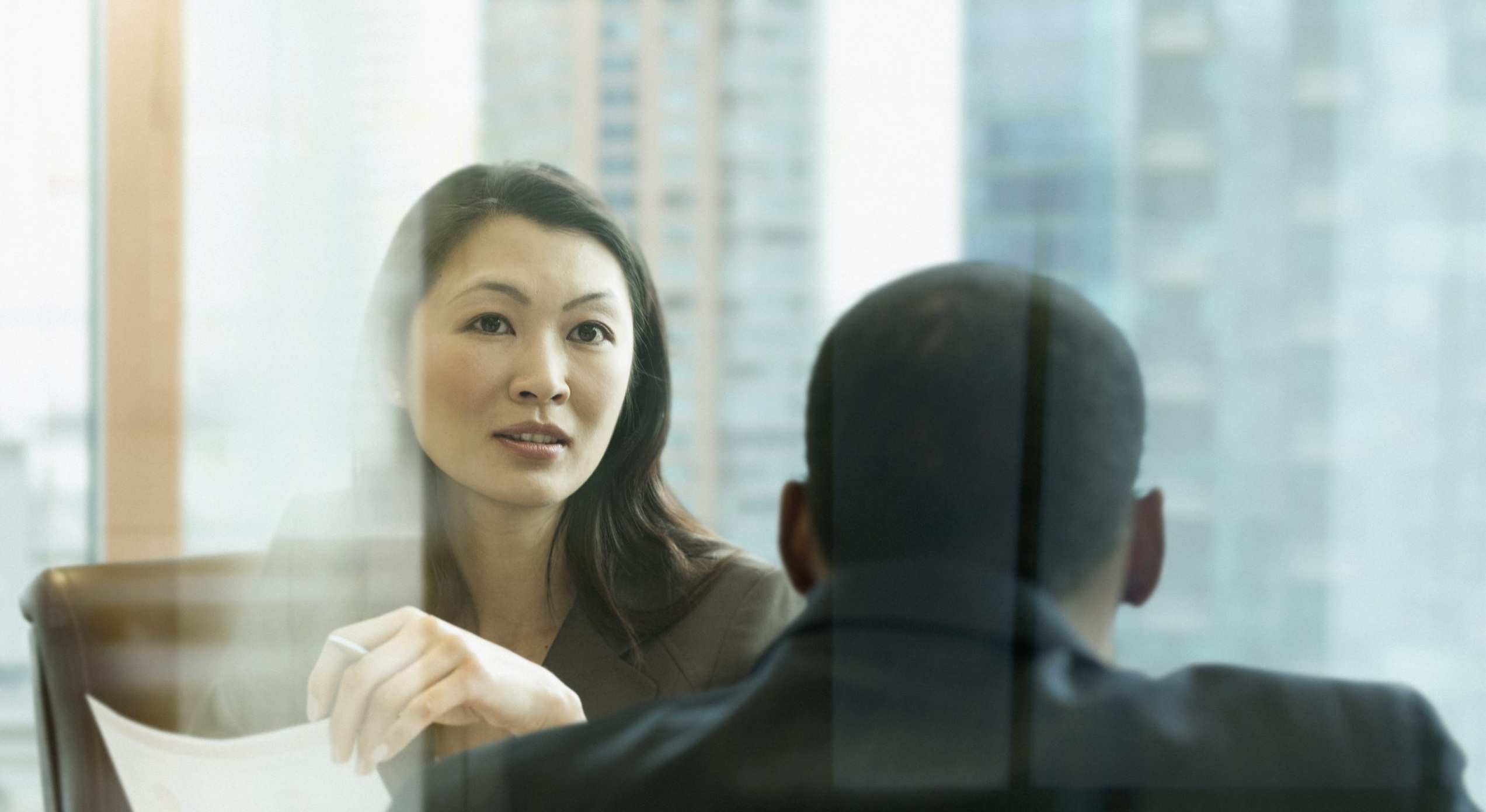Woman and man in business meeting